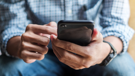 a man holding a cell phone